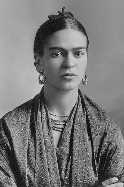 Frida Kahlo wearing a shawl with hair pinned back