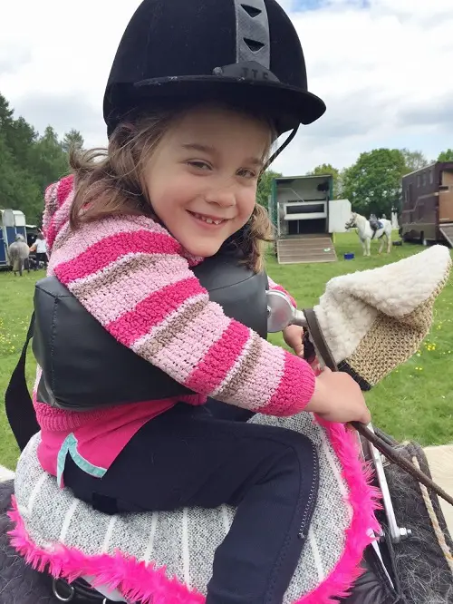 Horse riding aid for disabled child