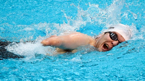 Disabled man swimming