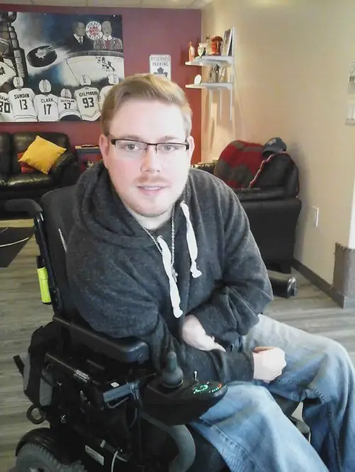 Alex Lytwyn in his wheelchair in his living room