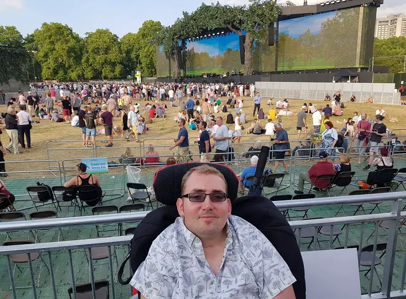 Alex Squire in wheelchair at Summer Time Ball