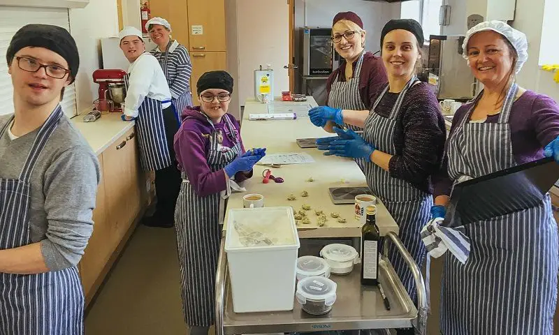 Trainee bakers with learning disabilities baking at Step and Stone