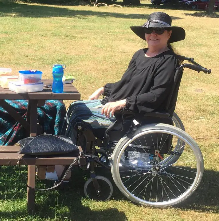 Helen Wheels in her wheelchair having a picnic