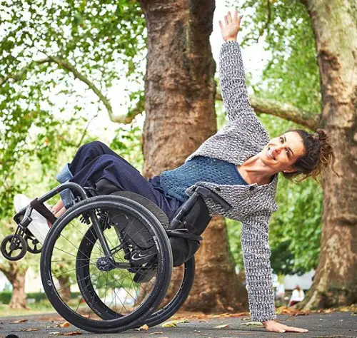 Samanta Bullock tilting her wheelchair back and balancing on her arm
