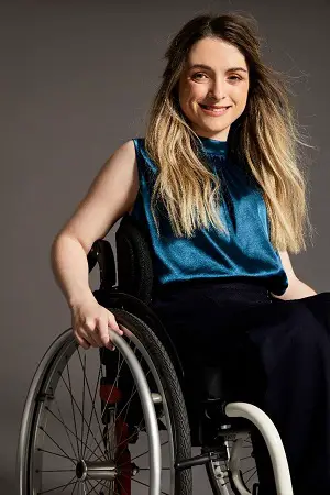 Wheelchair user in blue top