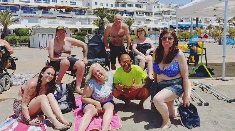 Disabled people on a beach on holiday