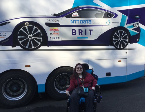 Emma Purcell in wheelchair in front of Team Brit racing car