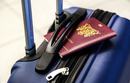 Passport on top of a suitcase
