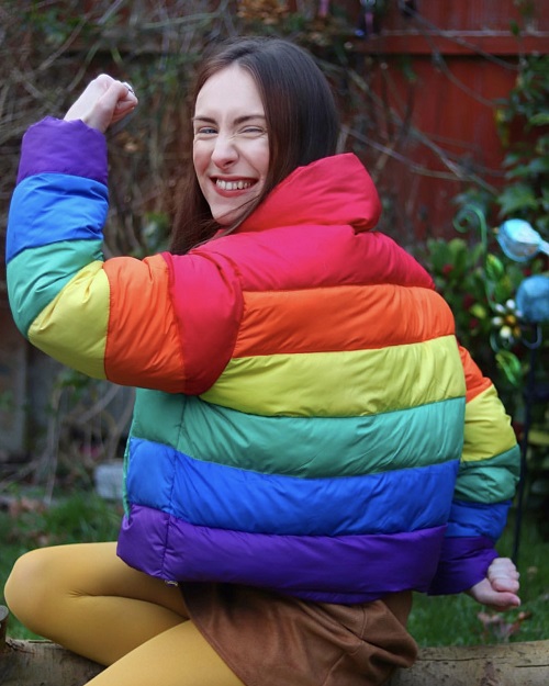 Rebecca Sullivan in a rainbow coat