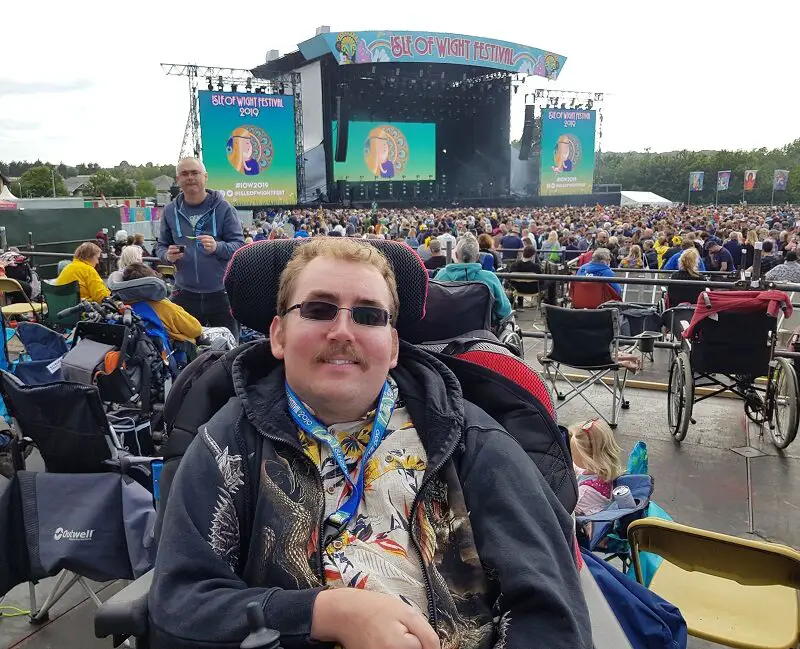 Wheelchair user Alex on a viewing platform the Isle of Wight festival