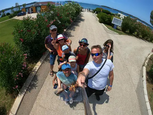 Wheelchair user Martyn Sibley with his fiance and family in Croatia near the beach