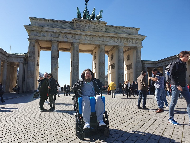 Derry Felton in his wheelchair outside the Brandenburg Gate