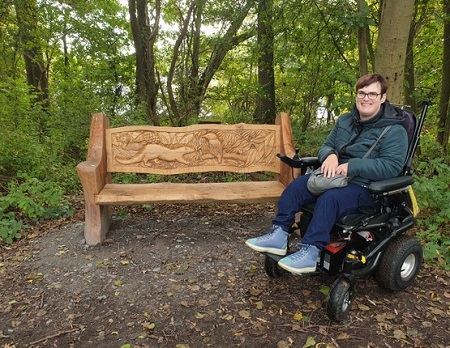Lucy Currier in her wheelchair in the woods