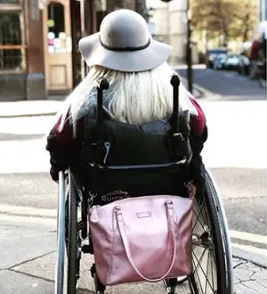 Sam Renke accessible handbag on the back of her wheelchair
