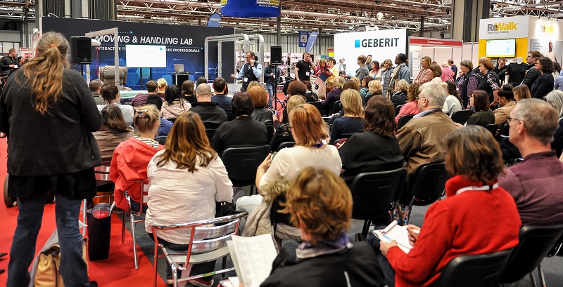 Crowd of people listening to a seminar at Naidex