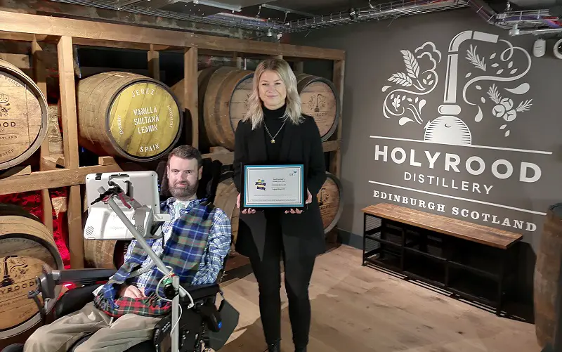 Holyrood Distillery award presented by Euan MacDonald