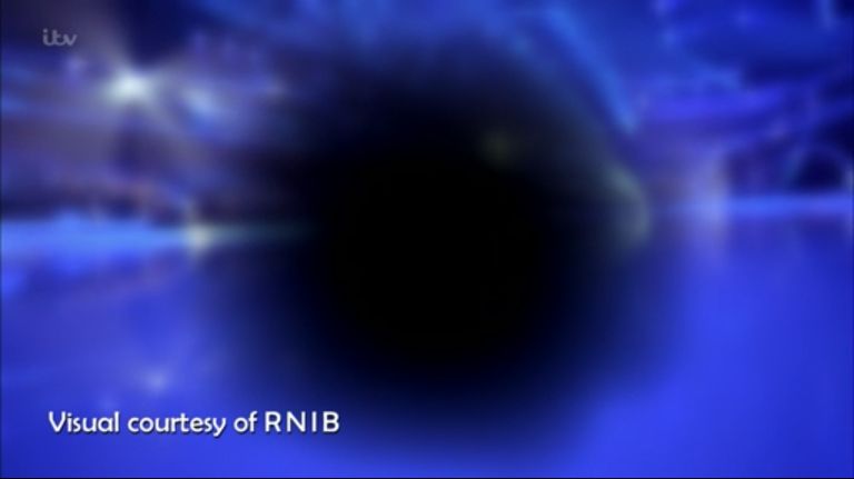 A black circle in the centre of the screen with some colour around the sides. Visual courtesy of RNIB