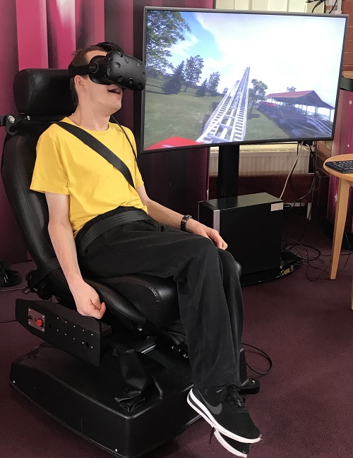 Disabled man using virtual reality at Revitalise accessible holiday