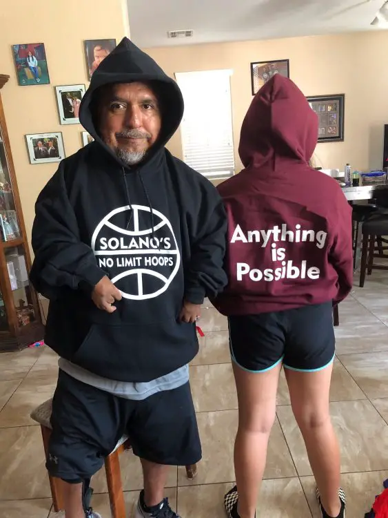 David wearing sweatshirts that say Solano's No Limit Hoops and Anything is Possible