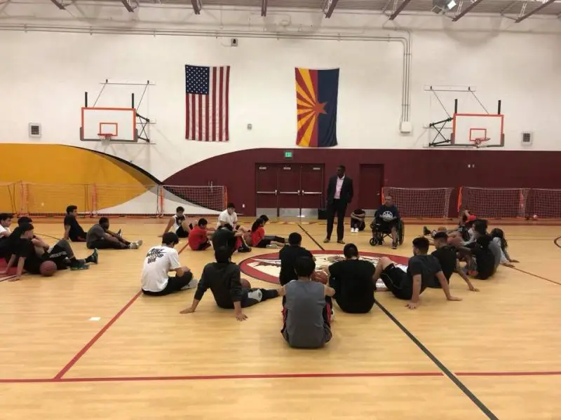 David coaching a group of students