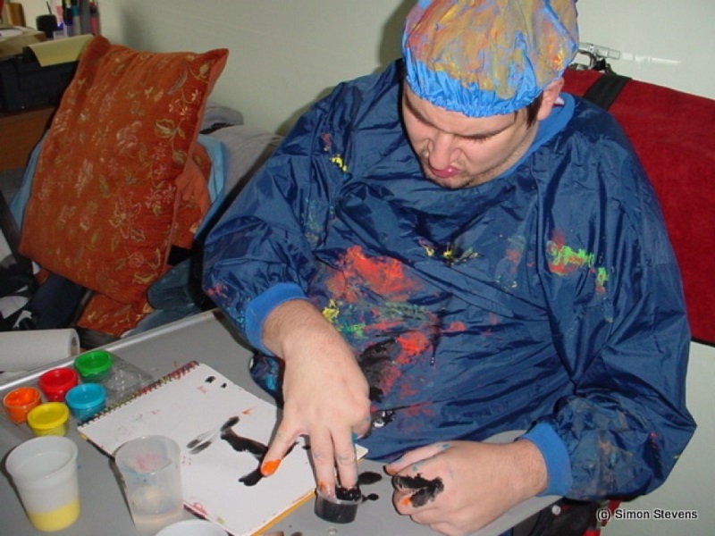 Simon Stevens doing messy play painting using his fingers