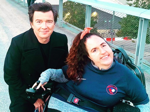 Georgina Moore in her wheelchair with Rick Astley