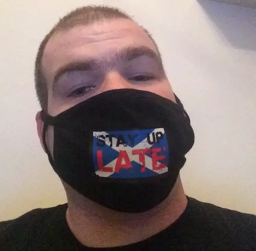 Michael Ewan in a face mask