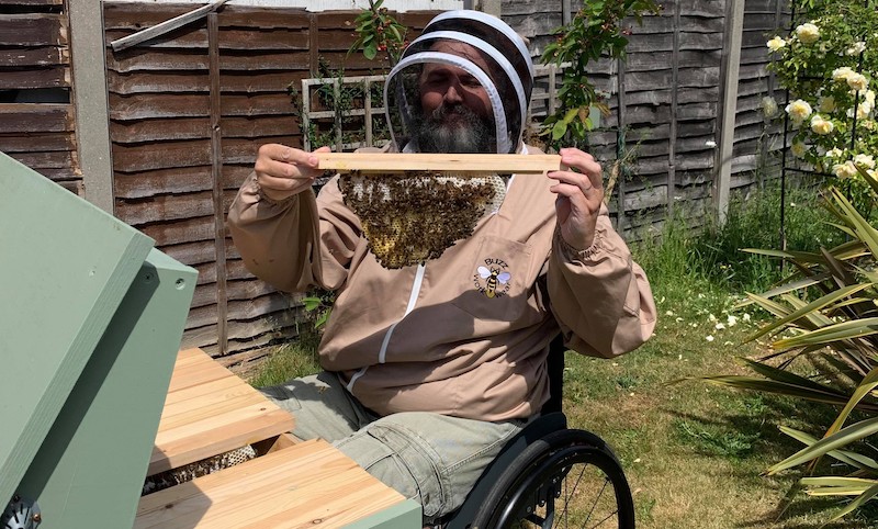 Zec Richardson in wheelchair bee-keeping