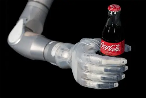 Bionic hand is holding a bottle