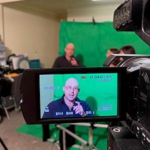 Blind filmmaker Gough filming in front of a green screen