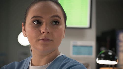 Gabriella Leon as Jade Lovall on Casualty wearing her nurse scrubs