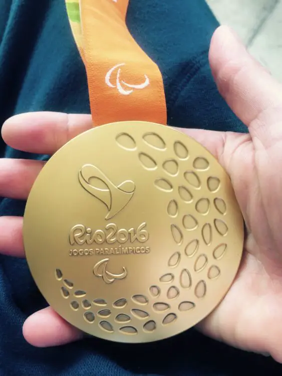 Emma Wiggs holding Gold Medal that she won at Rio 2016 Paralympic Games