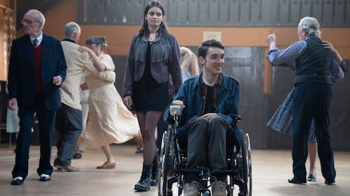 Maeve stood next to Isaac in his wheelchair on Sex Education
