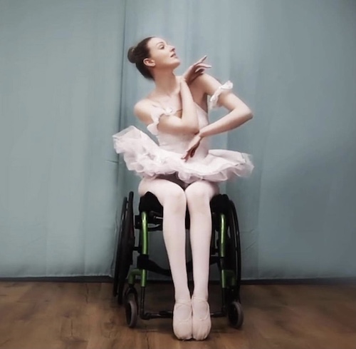 Kate Stanforth doing a ballet pose in her wheelchair 2
