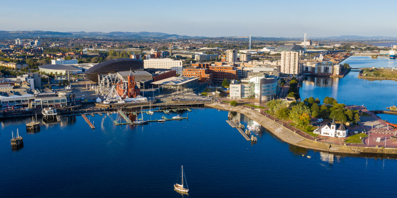 Cardiff Bay viewed from above showing iconic buildings, including the Pierhead, and the marina 