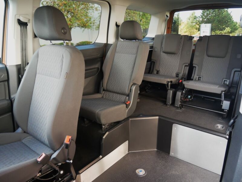 VW Upfront wheelchair accessible vehicle seats with four up and space for a wheelchair in the front on a lowered floor
