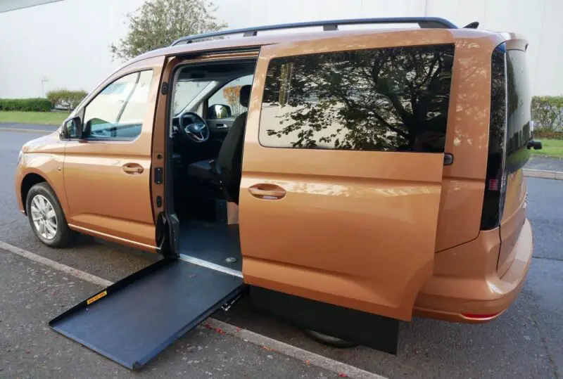 Golden VW Upfront wheelchair accessible vehicle side entry with the ramp out